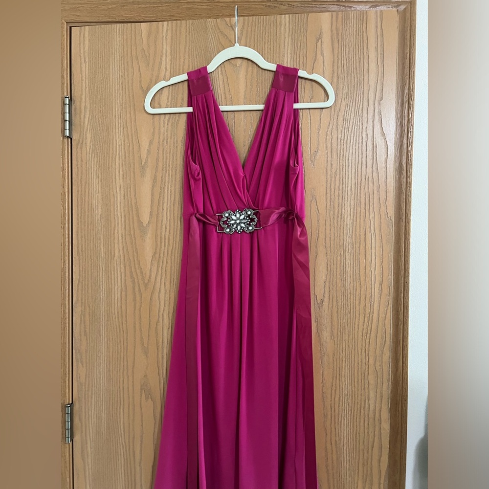 Size 8 pink sleeveless dress. Worn one time for a wedding.